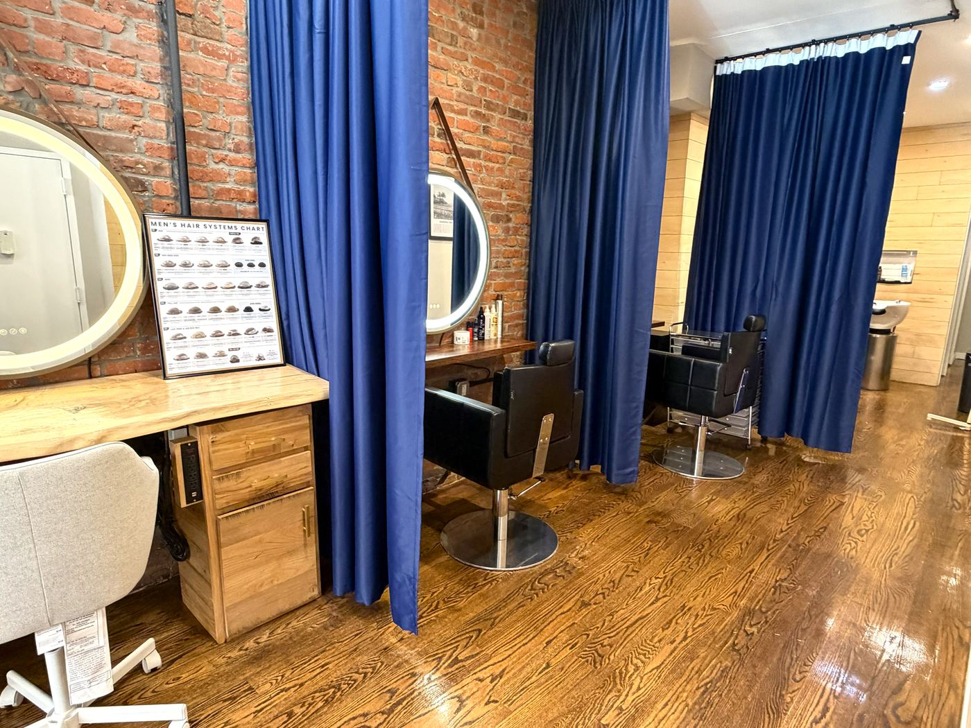 Private styling stations with curtained privacy at the Gen'C Chelsea salon